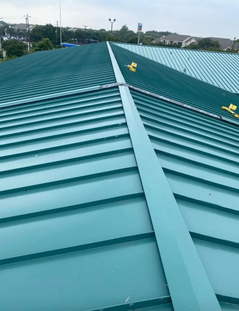 Green commercial metal roof ridge and valley for Metal Roof Repair in Paradise